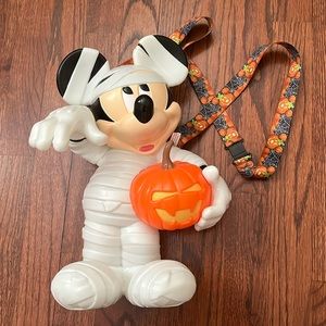 Mickey Mouse glow in the dark popcorn bucket and Donald candy corn sipper